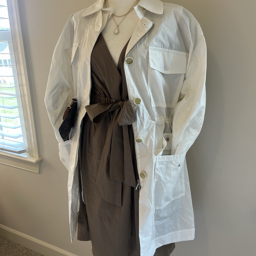 Trendy ATM white trenchcoat